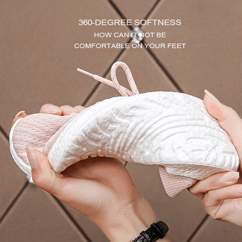 White knitted sneakers being tested for flexibility