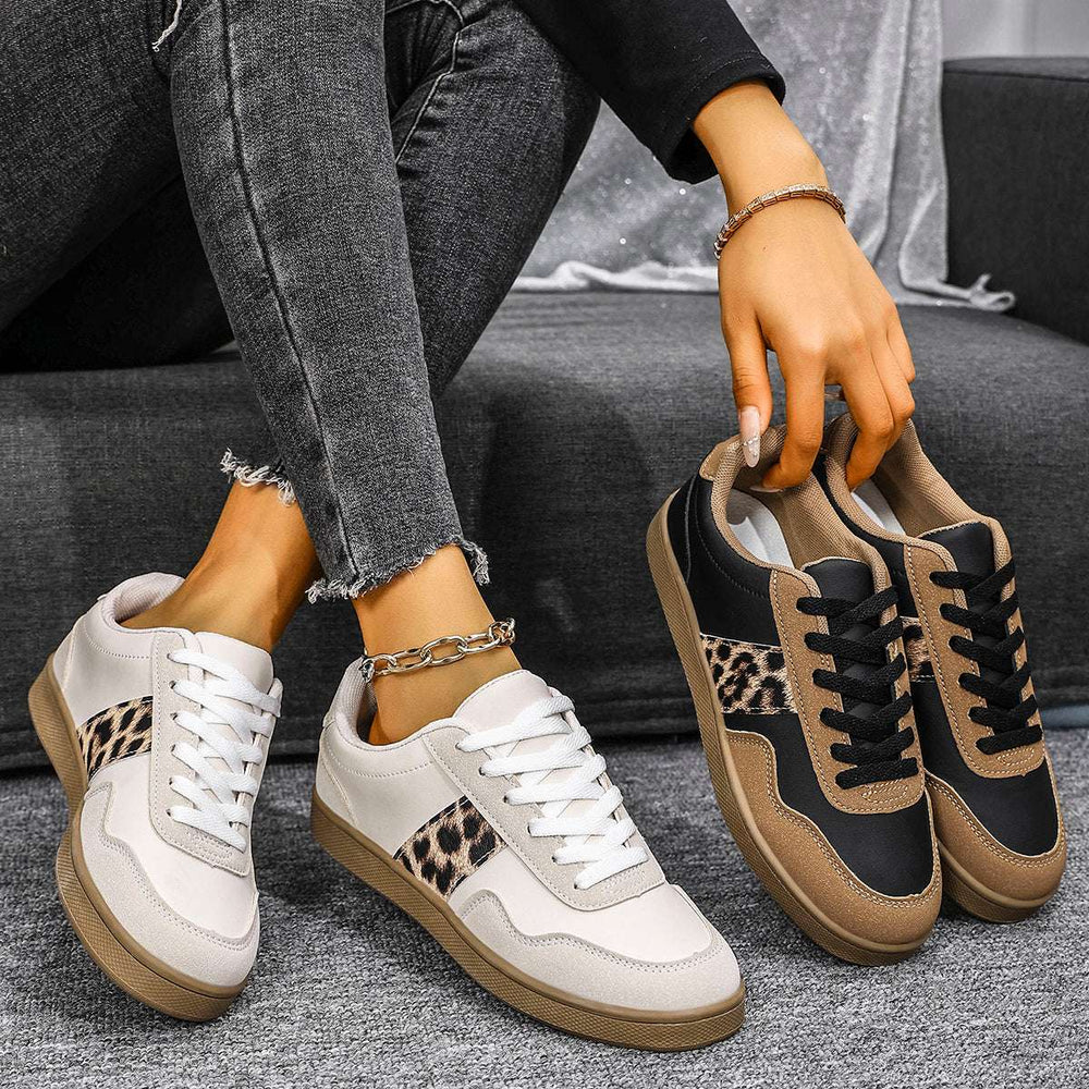 Women's sneakers with leopard print accents in white, black and brown color scheme