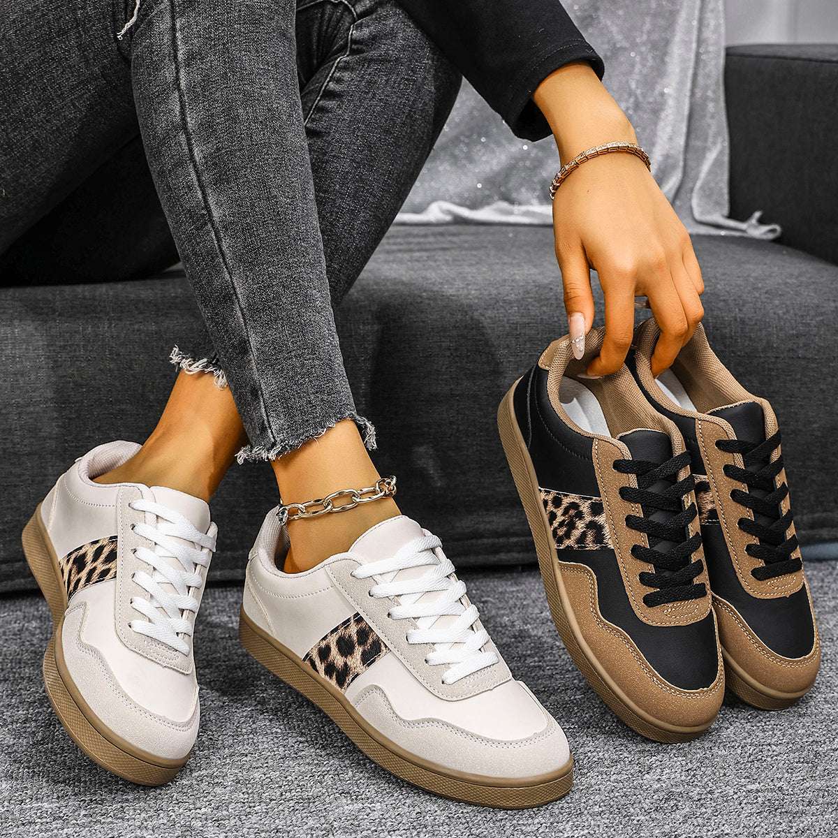 Women's sneakers with leopard print accents in white, black and brown color scheme
