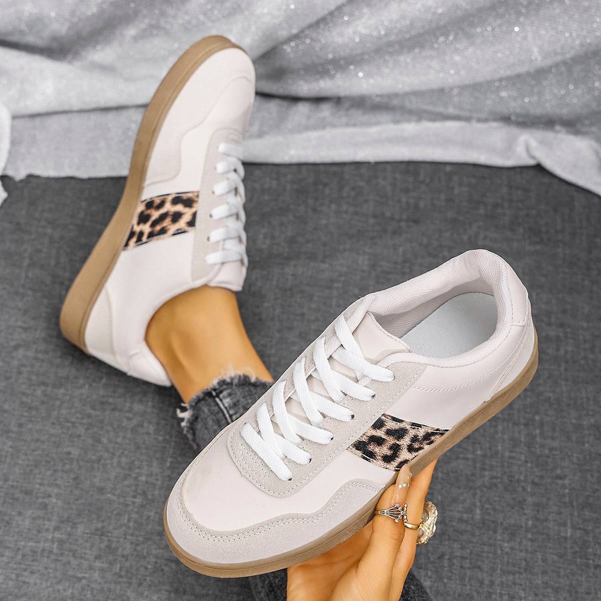 White women's sneakers with leopard print details